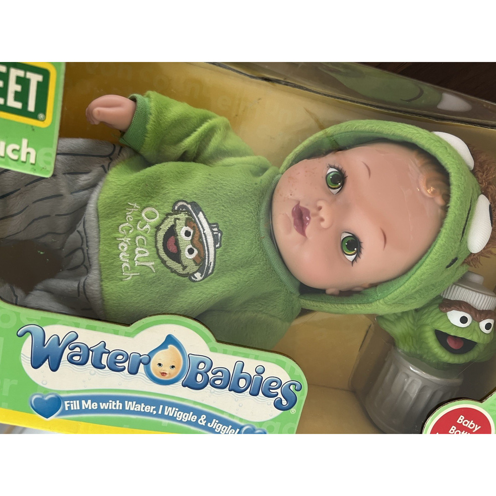 New boxed- Vintage Water Baby Sesame Street Oscar The Grouch 2006 w/Baby Bottle
